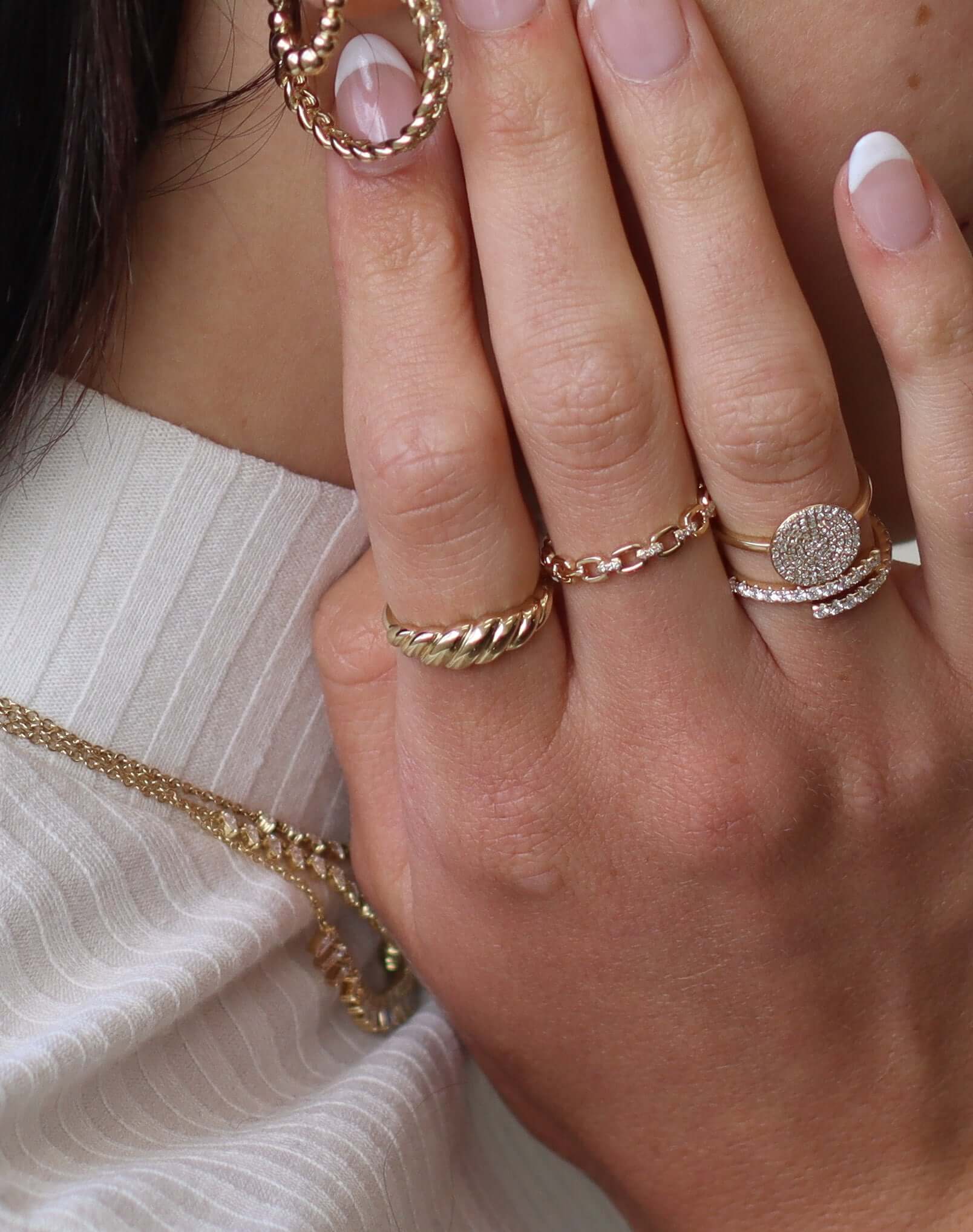 The Plain Gold Croissant Ring from Janet Heller Fine Jewelry is crafted in 14KT gold. The twisted band can be worn alone or stacked with other rings.