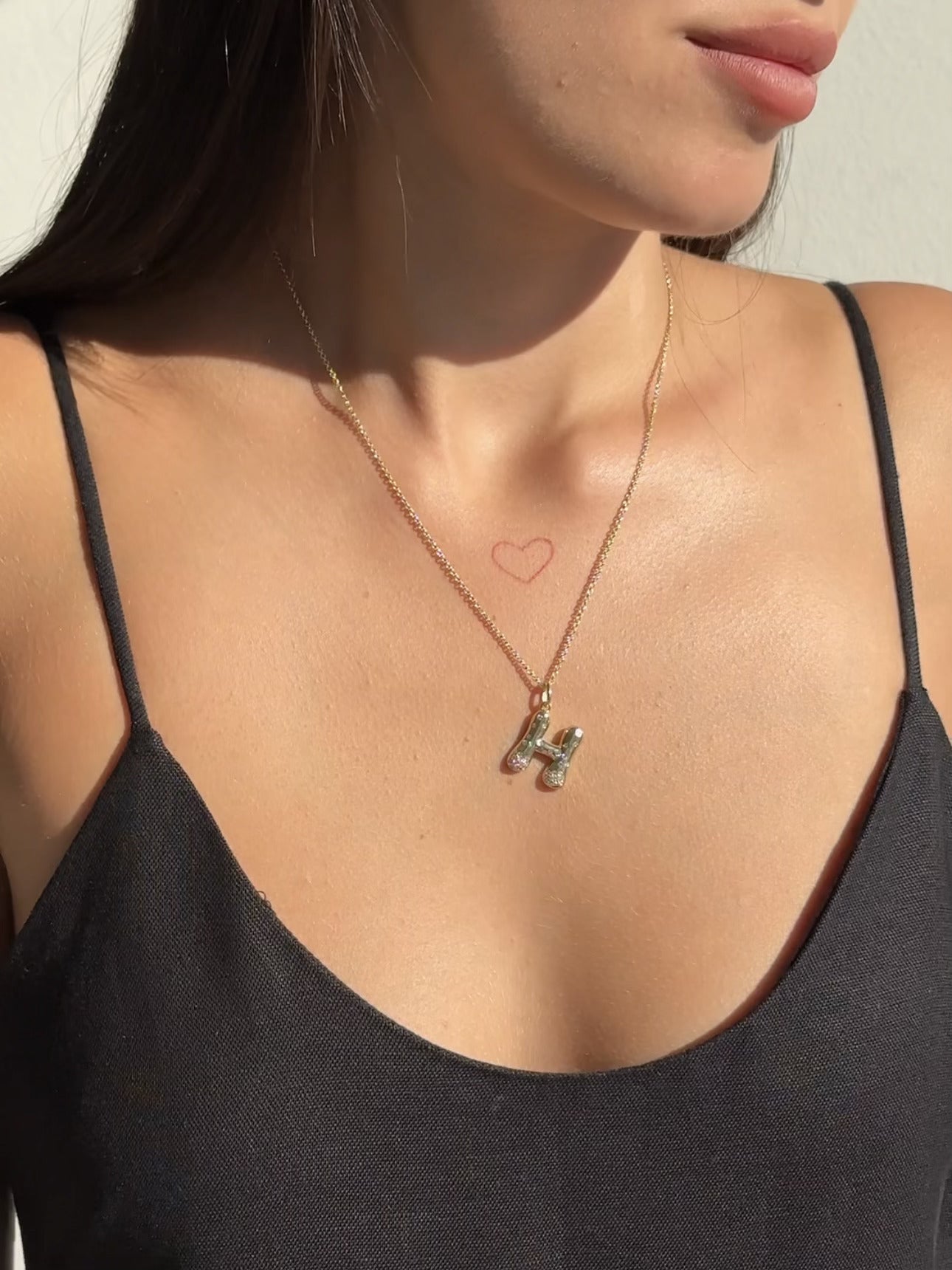 The Large Mosaic Diamond Letter Charm from Janet Heller Fine Jewelry is crafted in 14KT gold.  The pendant features a sprinkling of diamonds.   The clasp clips easily onto various Janet Heller Fine Jewelry chains and necklaces.