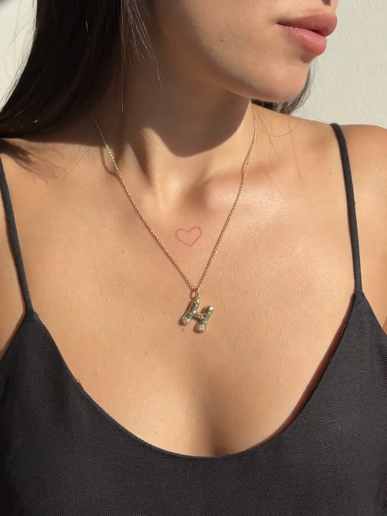 The Large Mosaic Diamond Letter Charm from Janet Heller Fine Jewelry is crafted in 14KT gold.  The pendant features a sprinkling of diamonds.   The clasp clips easily onto various Janet Heller Fine Jewelry chains and necklaces.