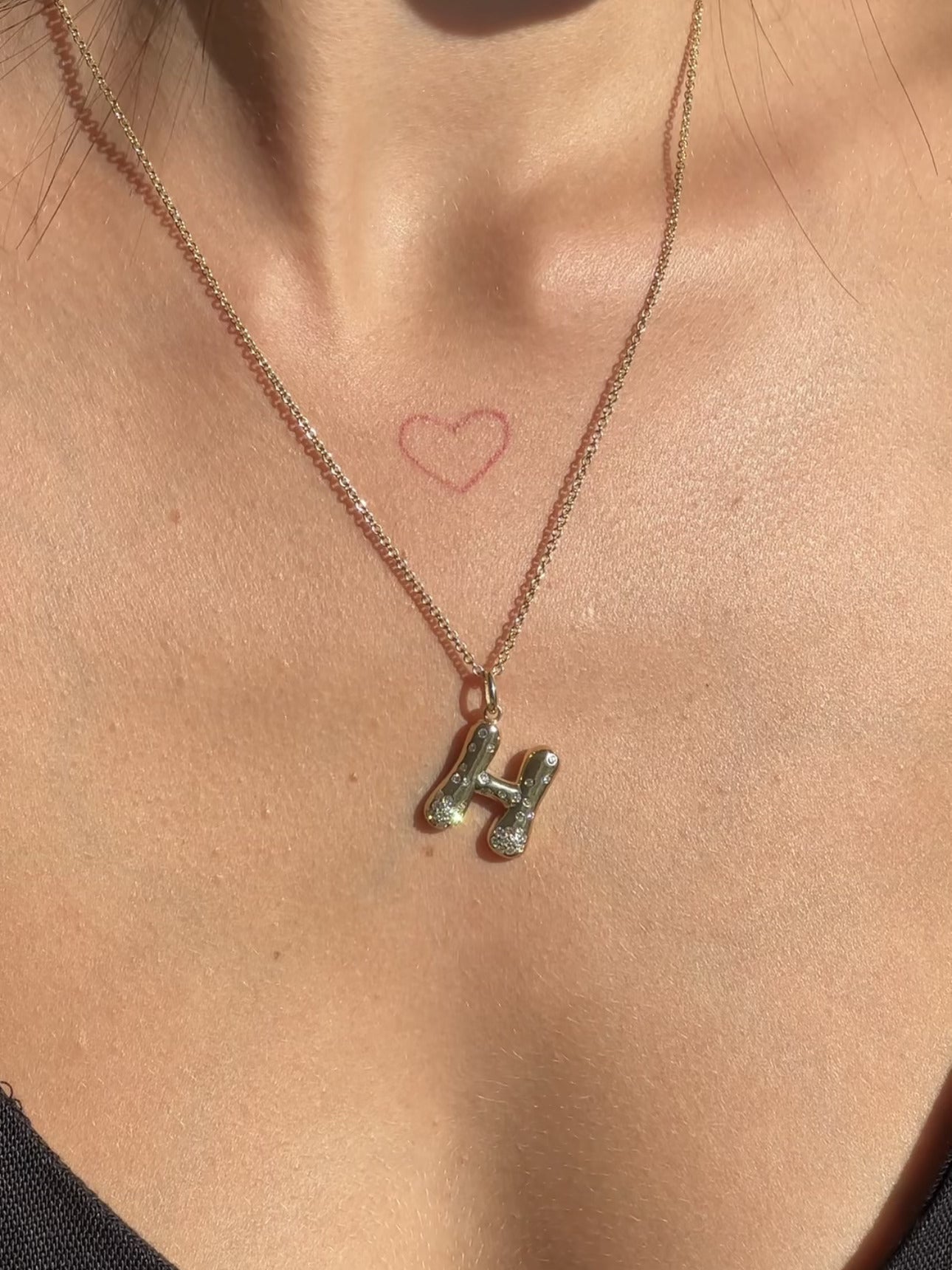 The Large Mosaic Diamond Letter Charm from Janet Heller Fine Jewelry is crafted in 14KT gold.  The pendant features a sprinkling of diamonds.   The clasp clips easily onto various Janet Heller Fine Jewelry chains and necklaces.