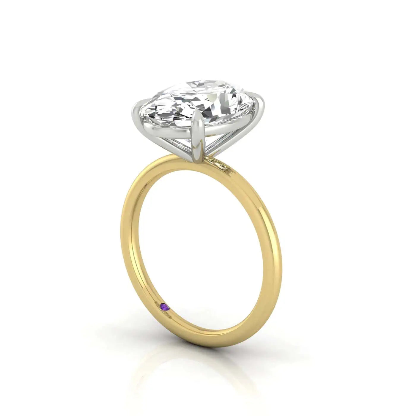 The Solitaire engagement ring features an exquisite large round diamond set in a silver prong on 18KT gold, elegantly showcased against a pristine white background.