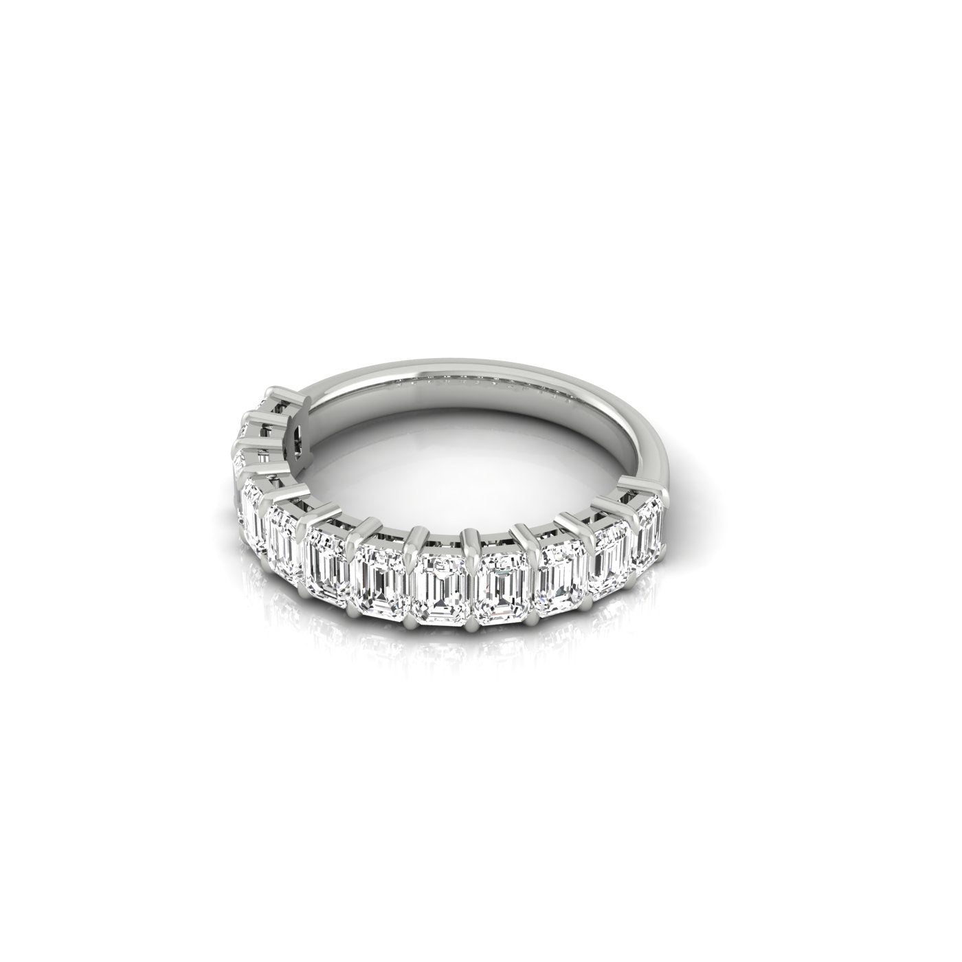 A Half Diamond Eternity Ring featuring a continuous line of rectangular, emerald-cut diamonds with VS clarity beautifully encircles the silver band, displayed on a white background.