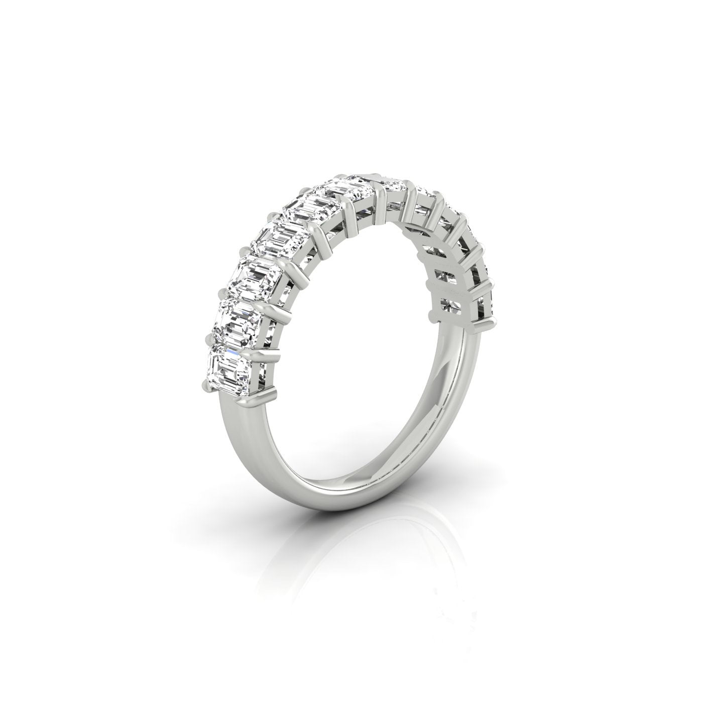 The Half Diamond Eternity Ring is a silver band adorned with clear, rectangular gemstones of VS Clarity on its top half, exuding a brilliant sparkle. The ring is displayed slightly tilted against a plain white background.