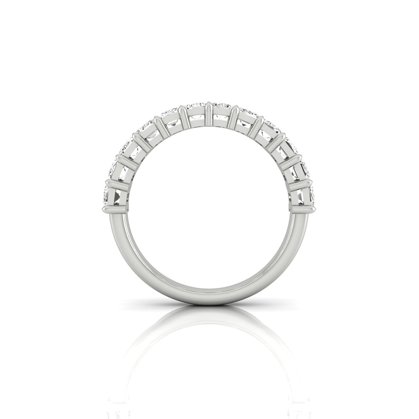 A side view of the Half Diamond Eternity Ring showcases VS Clarity diamonds arrayed on the top half, captured against a white background. The rings reflection below adds an extra touch of elegance.