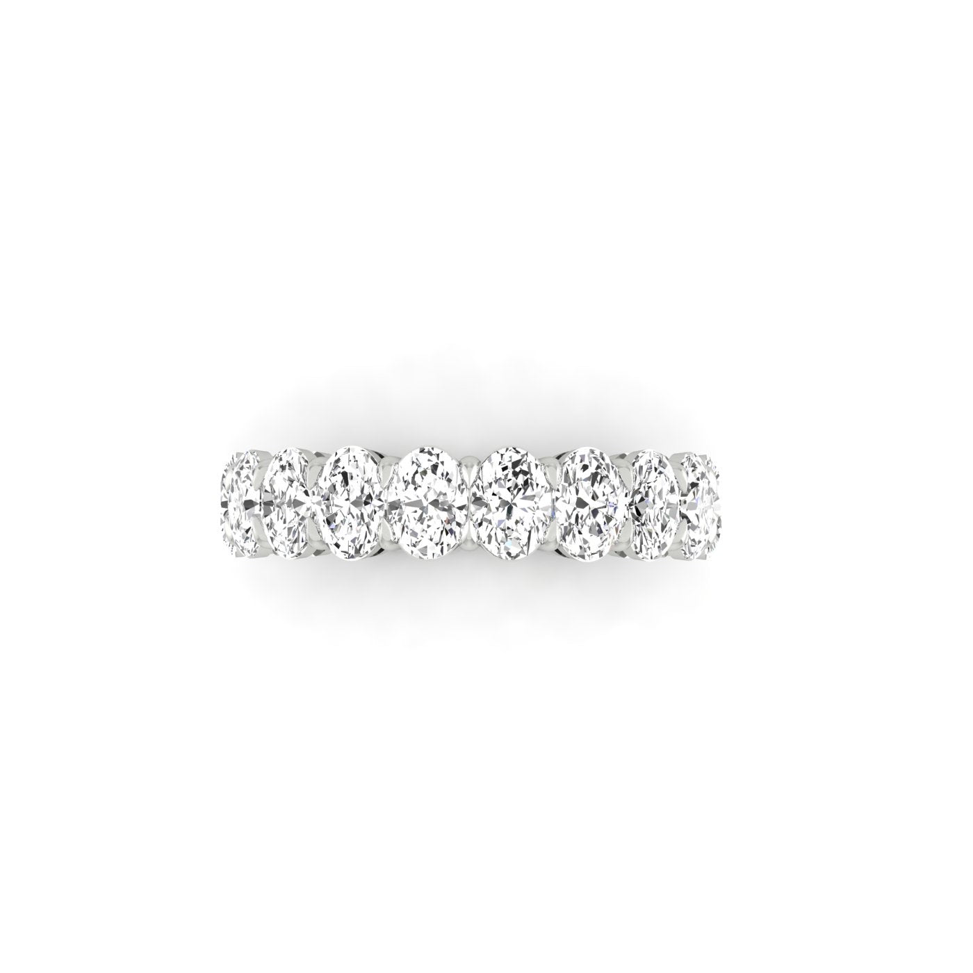 The Half Diamond Eternity Ring in silver features closely set, shimmering diamonds with VS clarity, elegantly displayed on a plain white background.