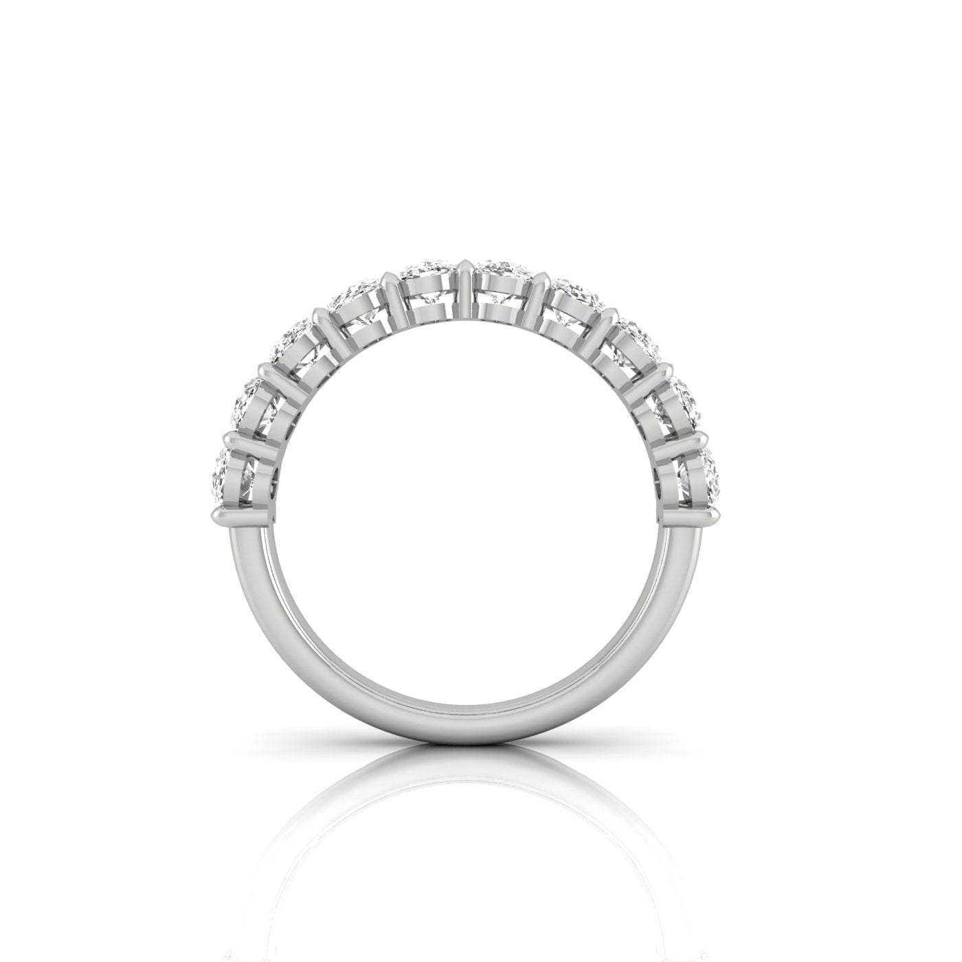 Side view of the Half Diamond Eternity Ring, showcasing multiple small VS Clarity diamonds set along the top half of its stunning silver band, elegantly reflecting light against a plain white background.