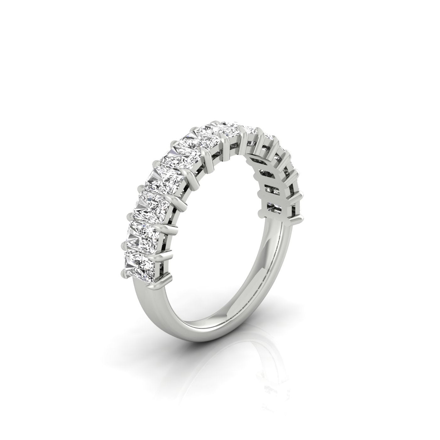 The Half Lab Grown Diamond Eternity Ring from Janet Heller Fine Jewelry, crafted in 18KT gold, features a row of evenly spaced diamonds offered in various shapes and custom carat weights. The color of the diamonds is F and the clarity is VS. This is the perfect wedding band to be worn alone or stacked with your engagement ring.