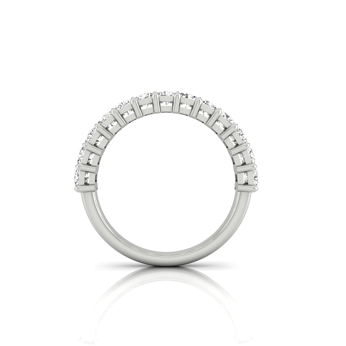 The Half Lab Grown Diamond Eternity Ring from Janet Heller Fine Jewelry, crafted in 18KT gold, features a row of evenly spaced diamonds offered in various shapes and custom carat weights. The color of the diamonds is F and the clarity is VS. This is the perfect wedding band to be worn alone or stacked with your engagement ring.