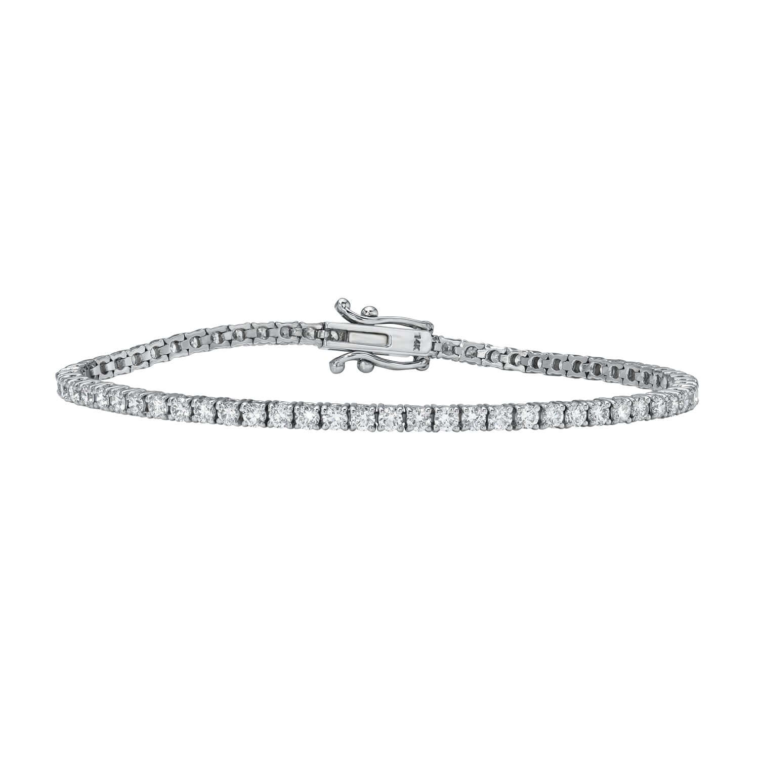 The 3ct Round Diamond Tennis Bracelet from Janet Heller Fine Jewelry is crafted in 14KT gold. The bracelet features  small diamonds in a continuous line and is available in both lab grown and natural diamonds.  The bracelet can be worn on its worn or layered with other bracelets.