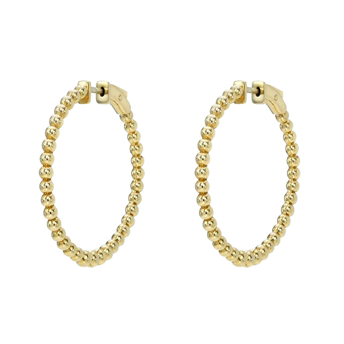 Nora Hoops, a pair of gold hoop earrings designed with small, round, beaded elements in a circular pattern, showcases exquisite fine jewelry craftsmanship. They are elegantly displayed against a pristine white background.