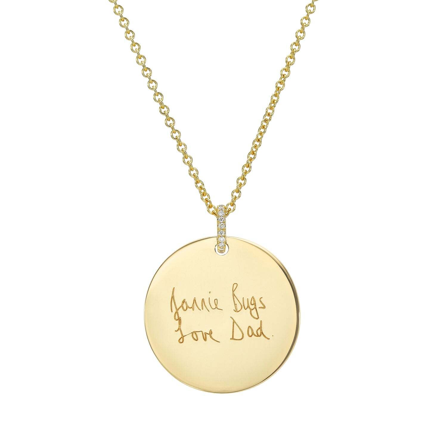 Introducing the Large Round Engravable Pendant Necklace—this beautiful piece of personalized jewelry features a gold round pendant with a handwritten engraving that reads, “Jamie Bugs Love Dad.” The pendant hangs from a delicate small-link chain and is highlighted by a diamond-accented loop, making it the perfect engraved keepsake to cherish special memories.