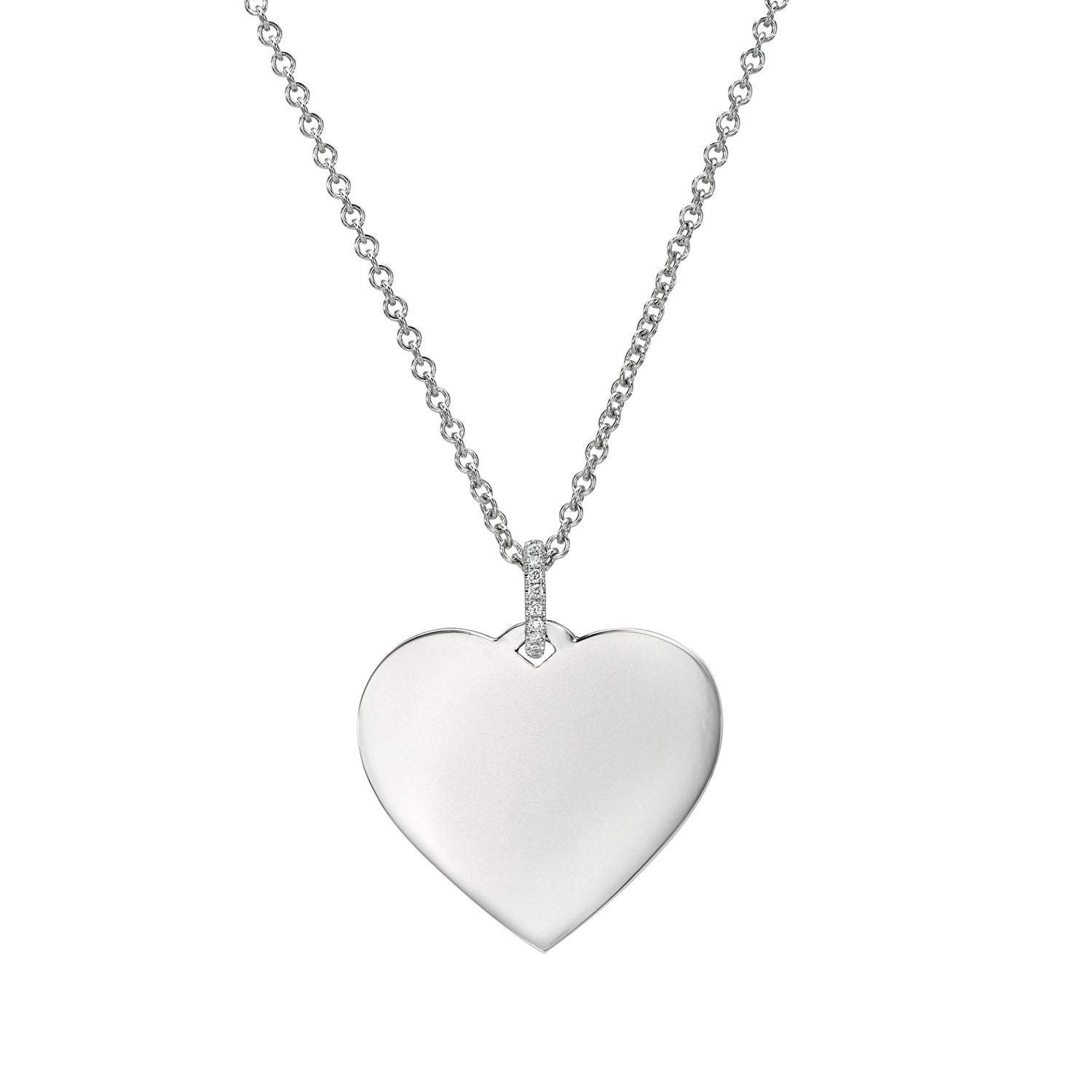 The Large Heart Engraveable Pendant Necklace showcases a silver, heart-shaped pendant with a minimalist design, customizable with engravings. It hangs on a delicate chain adorned with small links and tiny sparkling gems at the attachment point for added elegance.