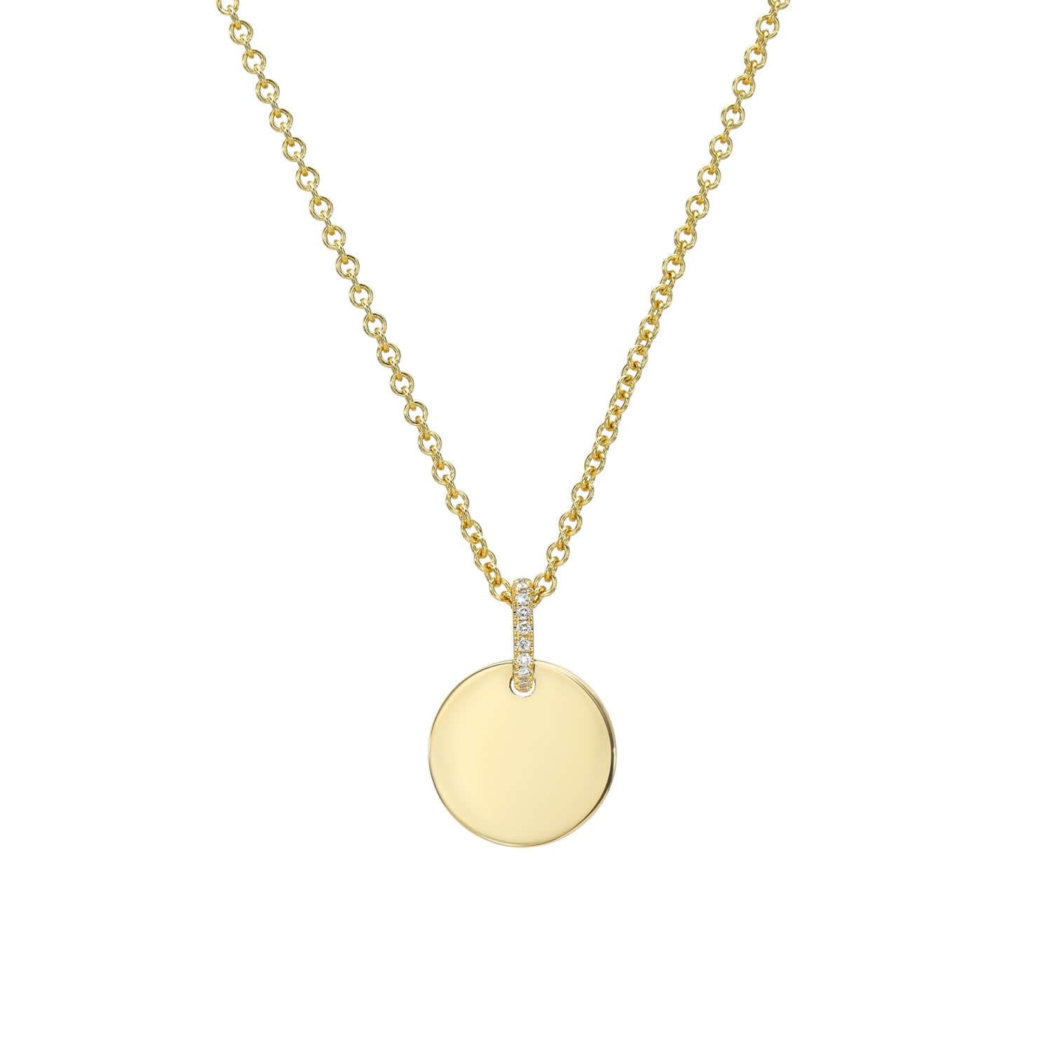 Part of the Sketch Collection, the Mini Round Engravable Pendant Necklace from Janet Heller Fine Jewelry is crafted in 14KT gold.  The necklace features a delicate chain with a diamond-studded loop and a round charm perfect for engraving a personalized message.