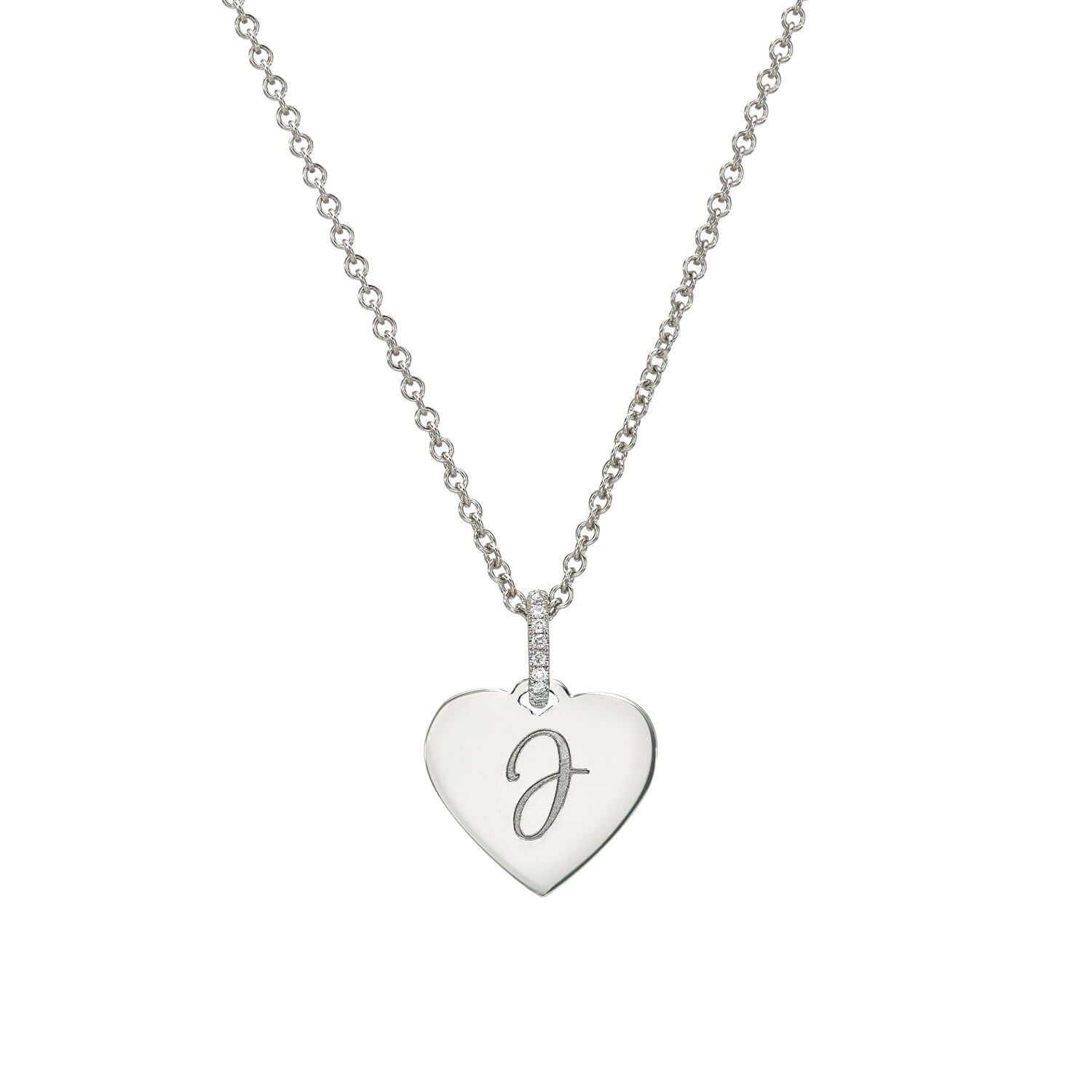 The Mini Heart Engravable Pendant Necklace from the Sketch Collection highlights a thin silver chain and a heart-shaped pendant engraved with a scripted J, enhanced by small crystals on the bail.