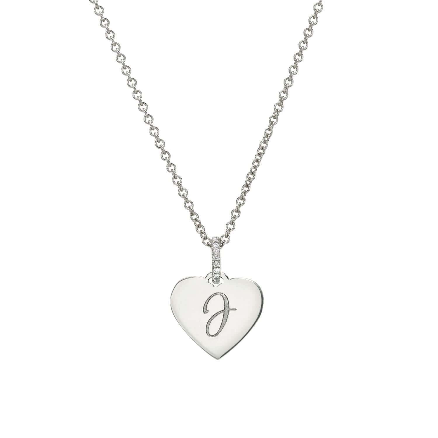 Part of the Sketch Collection, the Mini Heart Engravable Pendant Necklace from Janet Heller Fine Jewelry is crafted in 14KT gold. The necklace features a delicate chain with a diamond-studded loop and a heart-shaped charm perfect for engraving a personalized message.