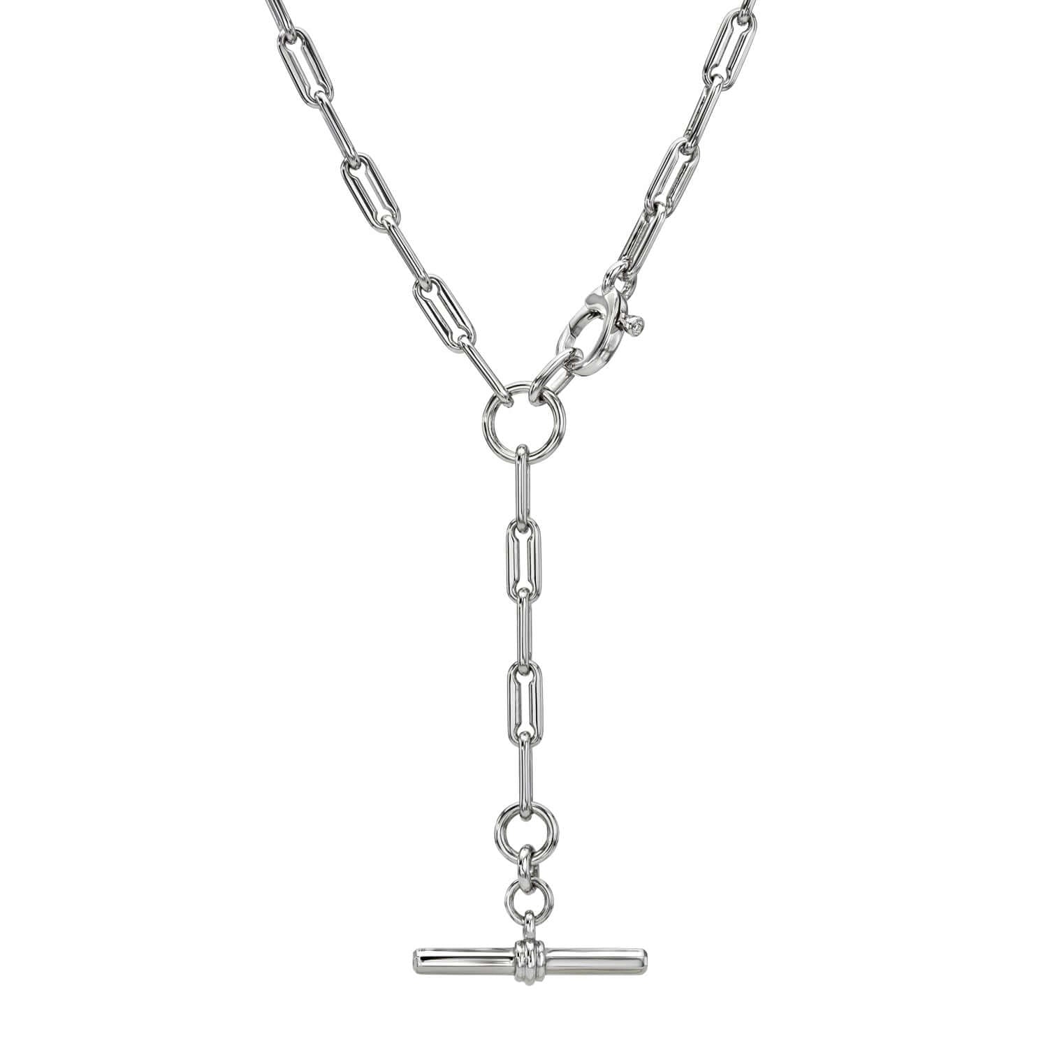 Explore the exquisite Toggle Link Kristen Necklace: a silver Y-shaped piece with large chain links, featuring a central toggle clasp and T-bar pendant on a short chain, offering elegance and customizable style.