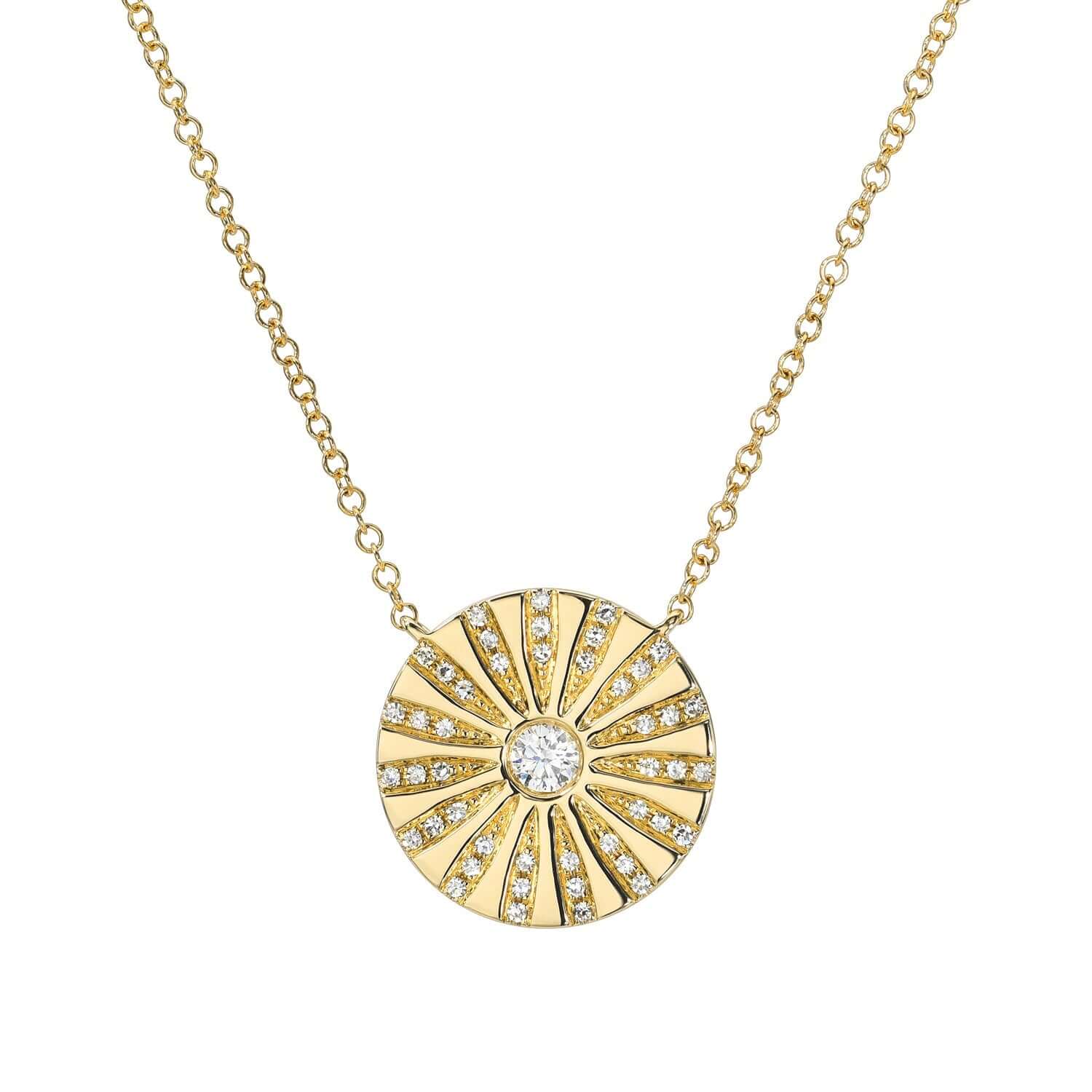 Experience the exquisite craftsmanship of Janet Heller Fine Jewelry with the Del Sol Diamond Circle Necklace. This gold piece, featuring a sunburst pendant with small diamonds and a central gem, offers customizable elegance on a delicate chain—ideal as a signature piece for any occasion.