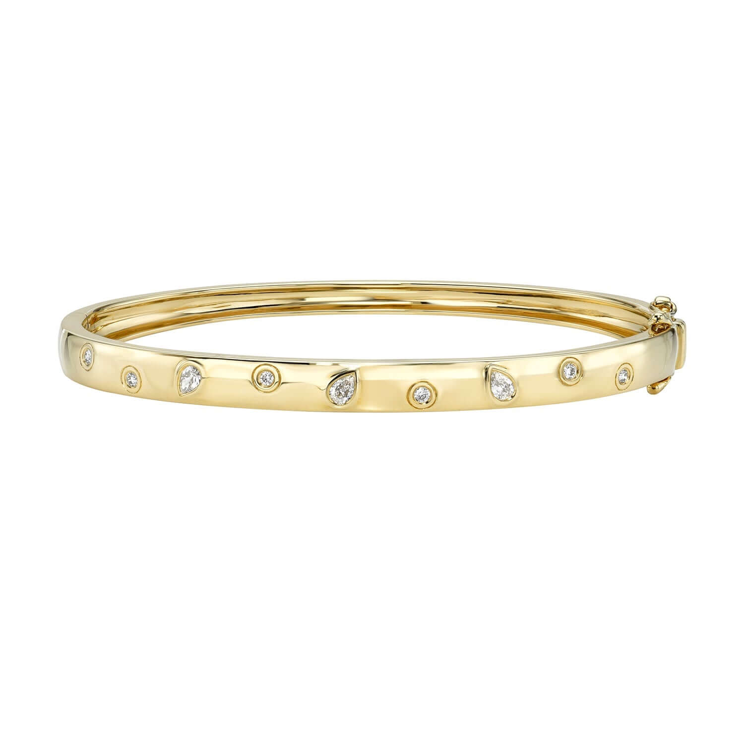 The Scattered Diamond Bangle is a gold bracelet adorned with small, evenly spaced round diamond accents. It features a smooth, polished finish with a hinged clasp for easy wearing.