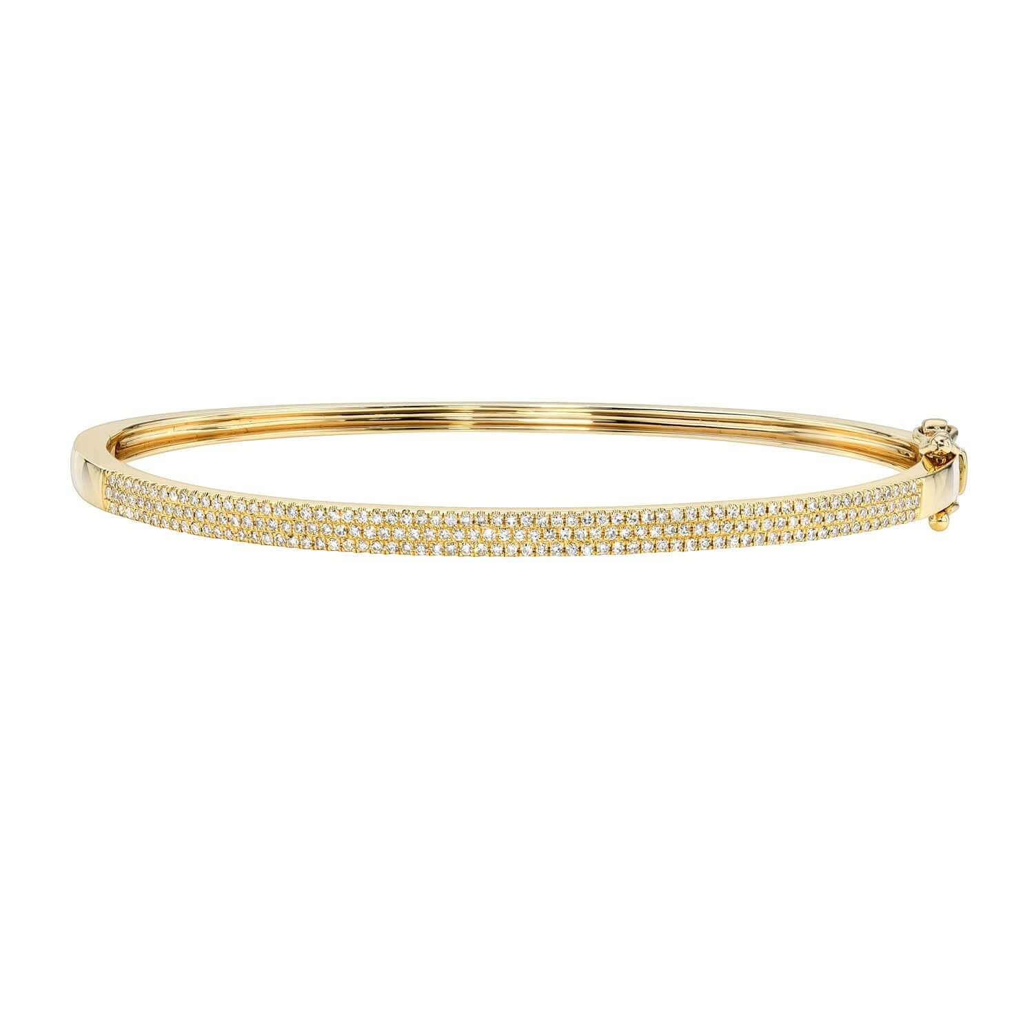 The Pave Diamond Aura Bangle from Janet Heller Fine Jewelry is crafted in 14KT gold.  The bracelet features three rows of pave diamonds.  The bangle can be stacked or worn on its own.