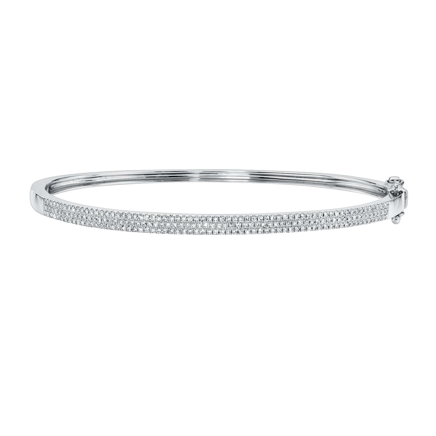 The Pave Diamond Aura Bangle from Janet Heller Fine Jewelry is crafted in 14KT gold.  The bracelet features three rows of pave diamonds.  The bangle can be stacked or worn on its own.