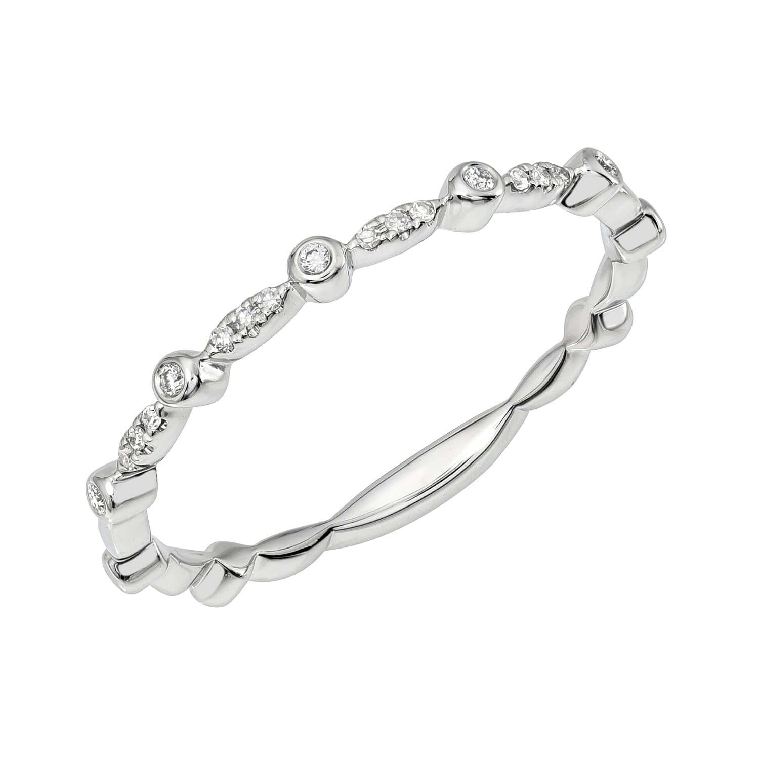 The Scalloped Diamond Bezel Ring from Janet Heller Fine Jewelry is crafted in 14KT gold.  The delicate band  features evenly spaced, small round-cut diamonds in a bezel setting. The symmetrical design is perfect for stacking or wearing solo.
