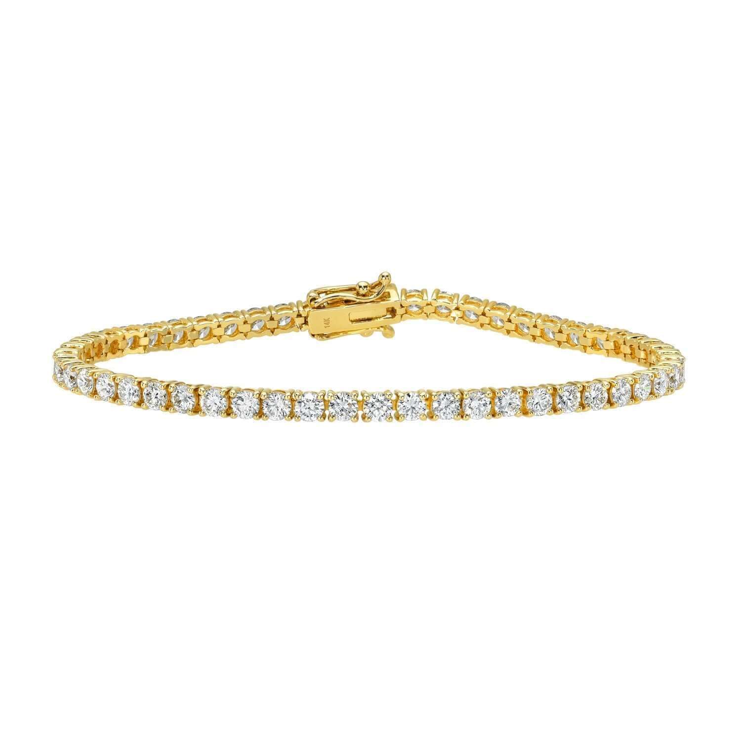 The 5ct Round Diamond Tennis Bracelet showcases a row of round natural diamonds set in gold with a secure clasp, displayed against a white background—a timeless piece of fine jewelry.
