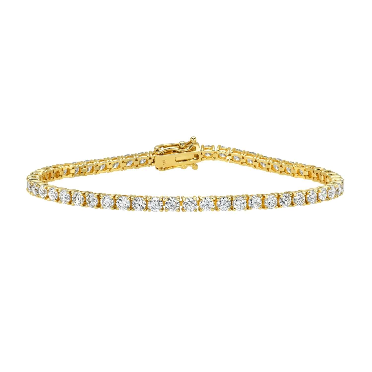 The 5ct Round Diamond Tennis Bracelet features a row of sparkling lab-grown diamonds set in a sleek gold chain, fastened with a secure clasp. Elegantly displayed against a plain white background, this piece epitomizes Janet Heller Fine Jewelry.