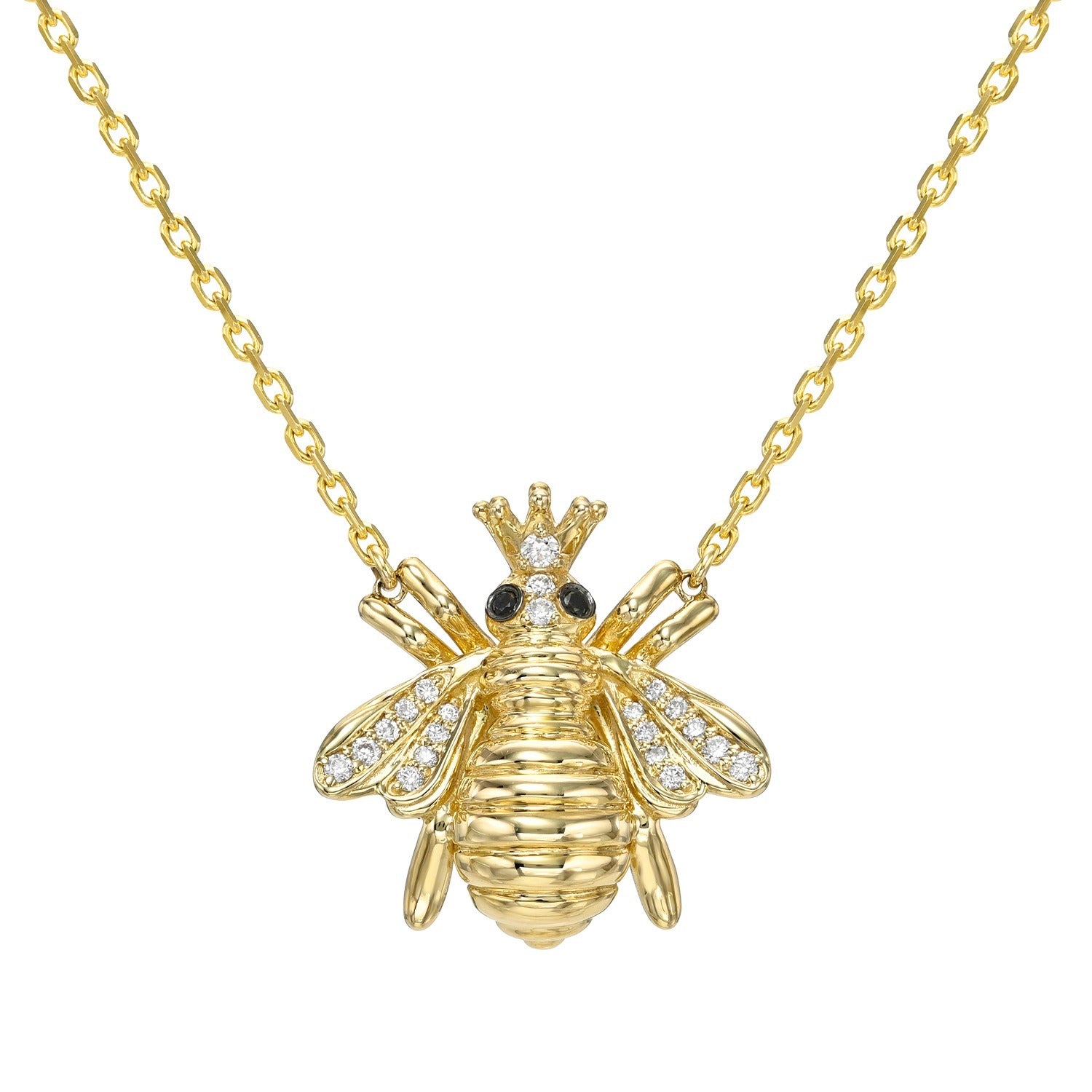 Jumbo Black & White Diamond Bee Necklace displayed on a plain white background. This exquisite 14KT gold necklace from Janet Heller Fine Jewelry features a bee-shaped pendant with a crown, black gemstone eyes, and wings adorned with small clear crystals, combining elegant craftsmanship and whimsical charm for a truly captivating piece.