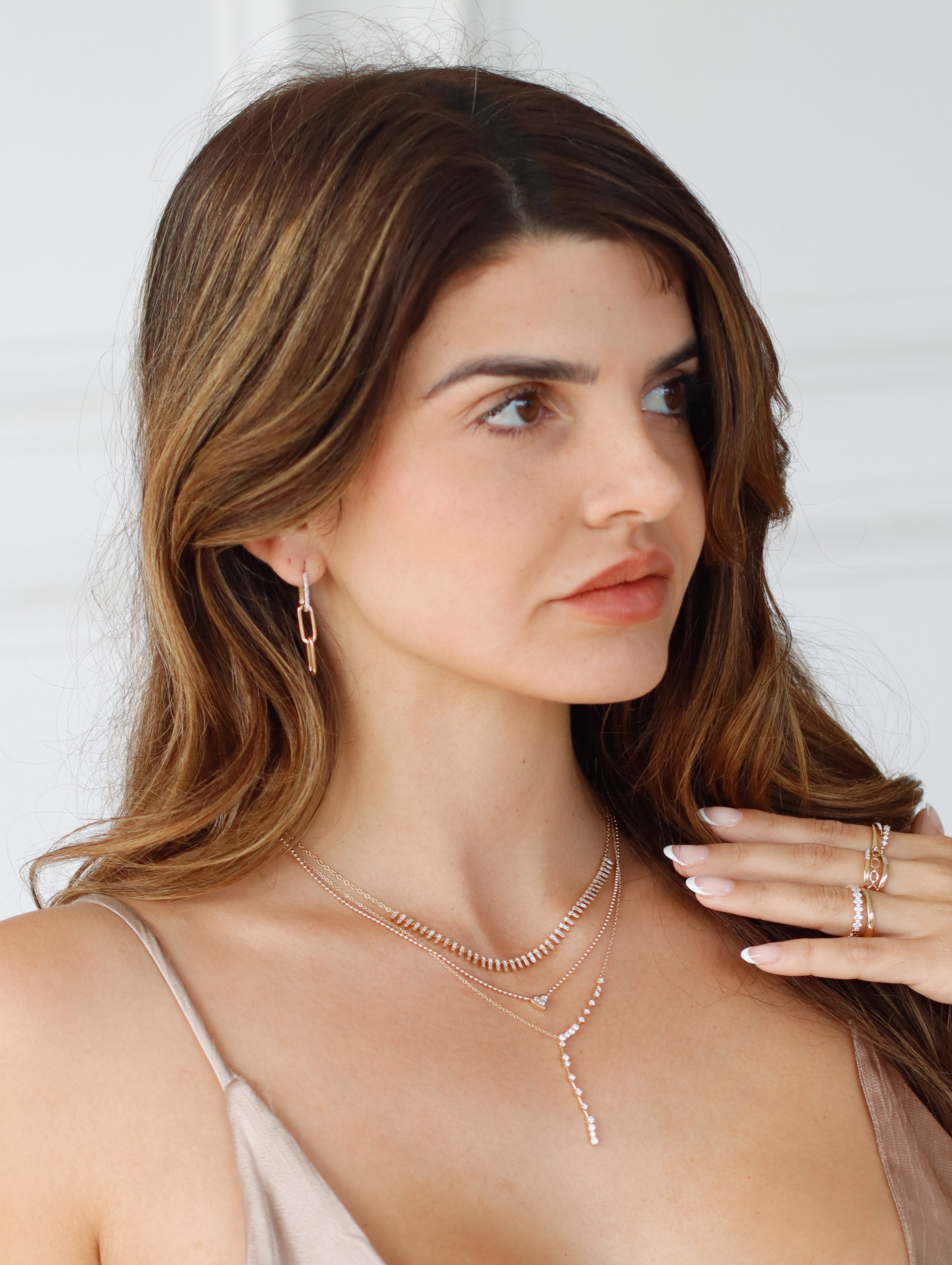 The Diamond Paperclip 3 Drop Earrings from Janet Heller Fine Jewelry is crafted in 14KT gold. The first link on the earrings feature diamonds followed by two plain gold links.
The earrings can be worn on their own or layered along the ear with other earrings.