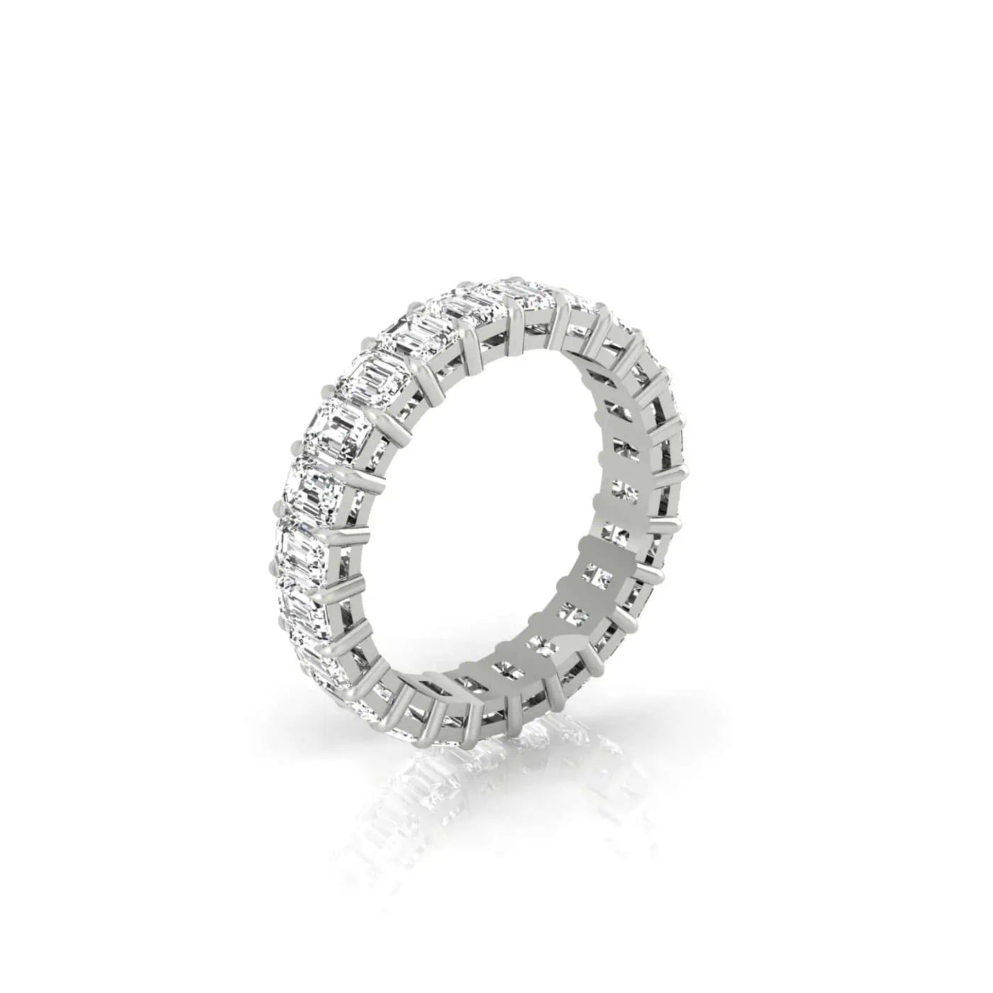 The Full Diamond Eternity Ring features rectangular-cut clear VS clarity gemstones encircling the band, set in shimmering 18KT gold. Its elegant and sparkling design is highlighted on a white background.