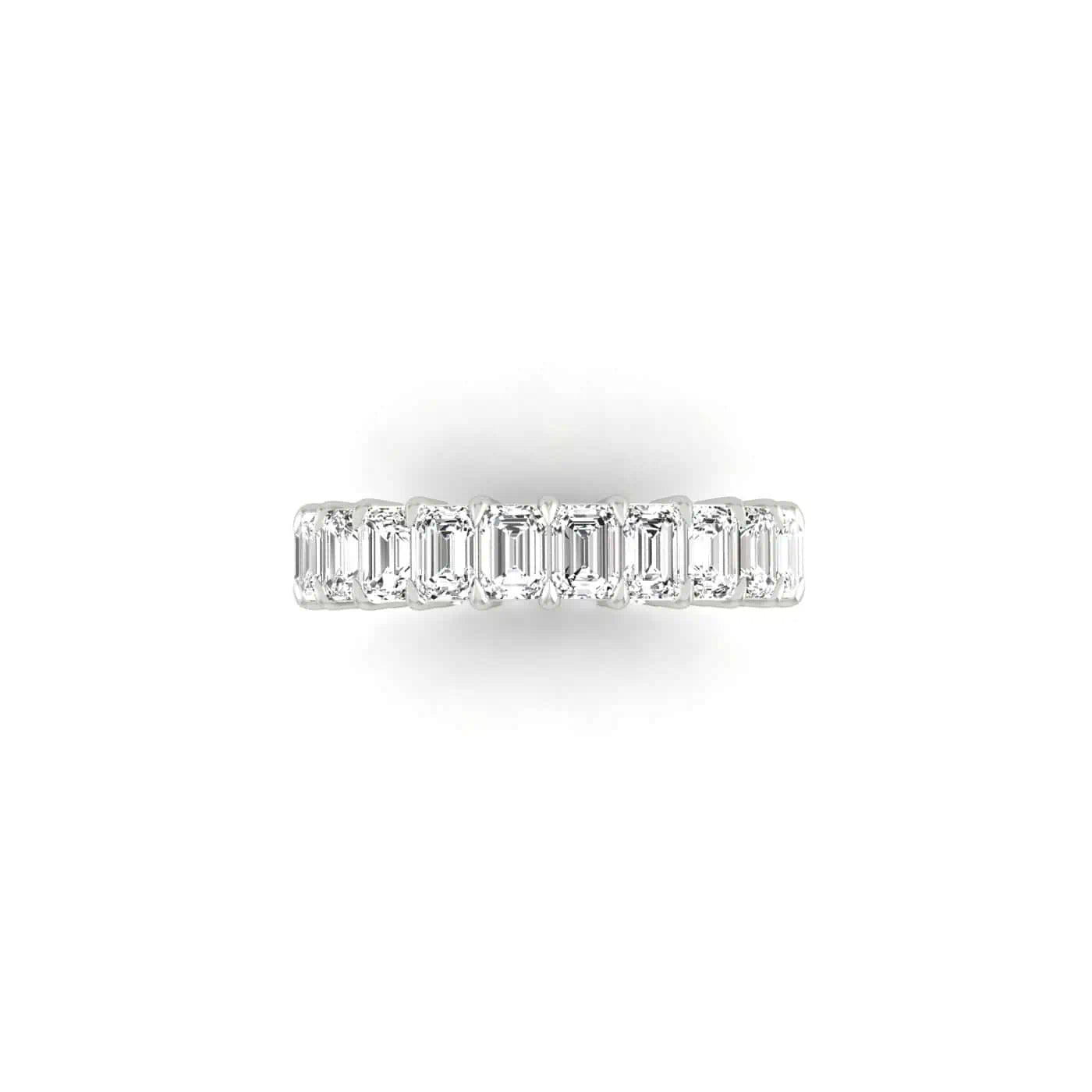 A top view of a Full Diamond Eternity Ring in silver, featuring rectangular-cut gemstones with F Color and VS Clarity encircling the band, set against a plain white background.