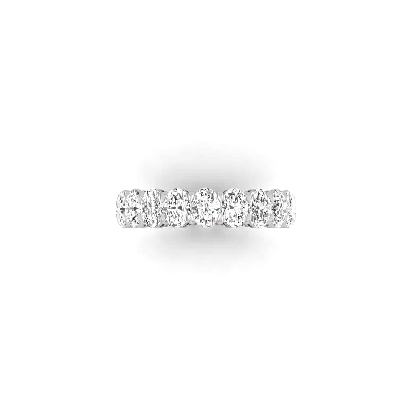 Introducing the Test - Full Diamond Eternity Ring: This exquisite 18KT gold band showcases nine round, sparkling F color VS clarity diamonds set in a row, beautifully displayed from above on a white background.