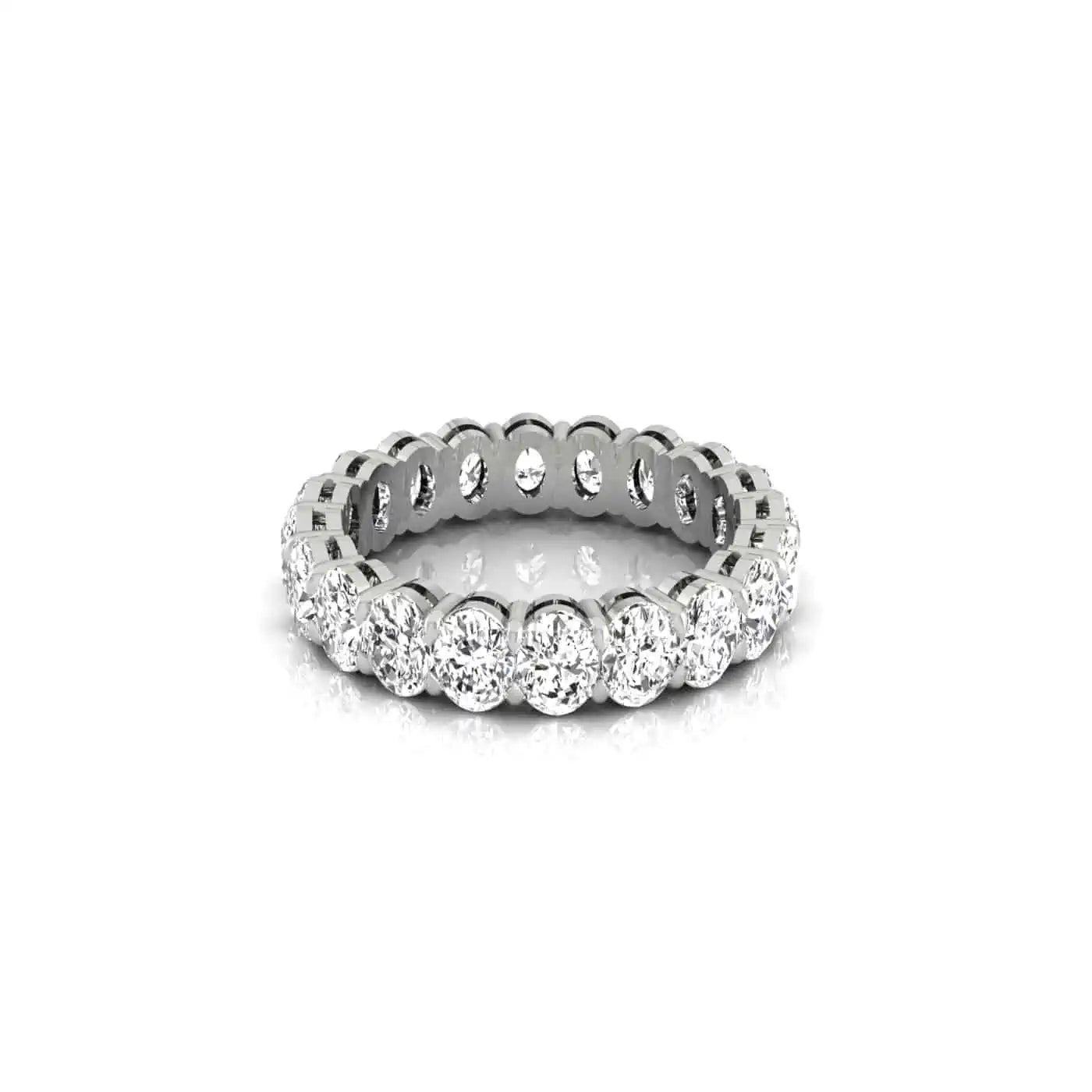 The Full Diamond Eternity Ring from Janet Heller Fine Jewelry, crafted in 18KT gold, features evenly spaced diamonds offered in various shapes and custom carat weights. The color of the diamonds is F and the clarity is VS. This is the perfect wedding band to be worn alone or stacked with your engagement ring.