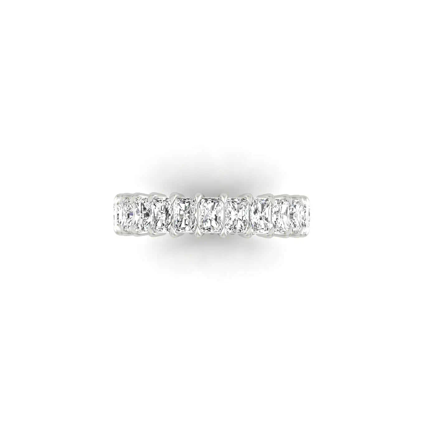 A close-up of the Full Diamond Eternity Ring, a silver band crafted from 18KT gold, adorned with numerous sparkling gemstones of F color and VS clarity, viewed from the top on a pristine white background.
