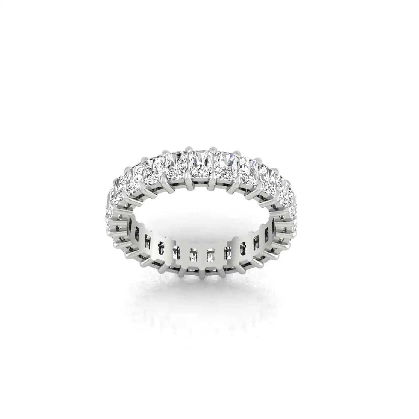 The Full Diamond Eternity Ring, a silver band adorned with VS Clarity diamonds encircling continuously, sparkles elegantly against a white background.
