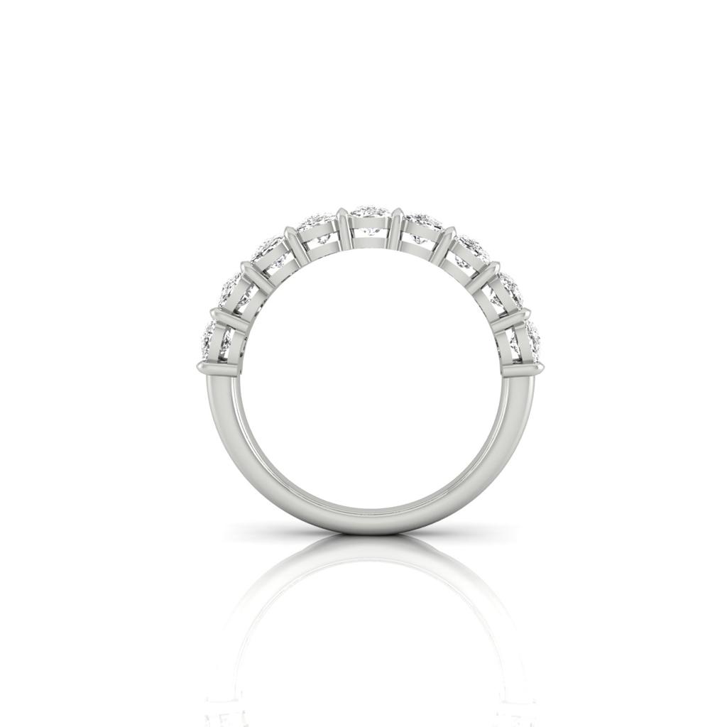 The Half Diamond Eternity Ring, available in silver or 18KT white gold, features VS Clarity diamonds evenly set across the top half, shown from a side view on a plain white background.
