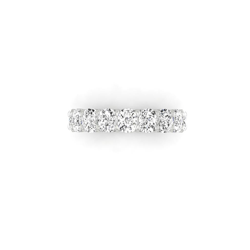 The Half Diamond Eternity Ring is a silver band encircled with round-cut VS Clarity diamonds, showcased on a white background.