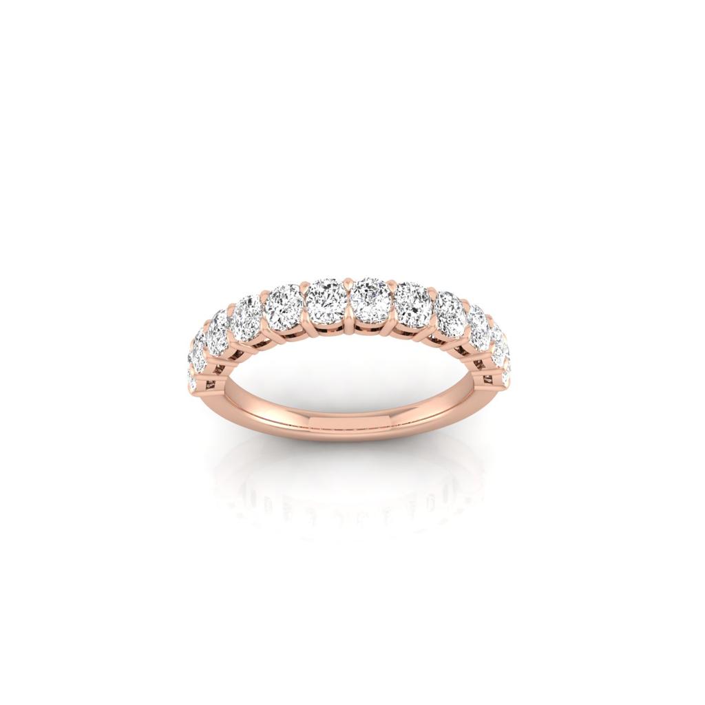 The Half Lab Grown Diamond Eternity Ring, made of 18KT rose gold, features a smooth band with evenly spaced round diamonds across the top, creating an elegant and sophisticated appearance.