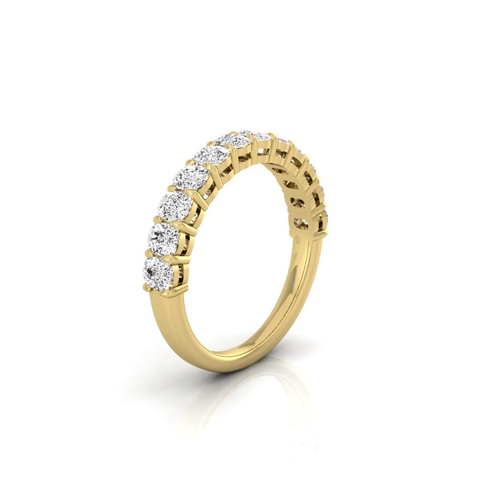 The Half Lab Grown Diamond Eternity Ring is a custom-made 18KT gold piece showcasing round white gemstones elegantly set along the top half of the band. Photographed against a white background, its intricate design exudes timeless charm and sophistication.