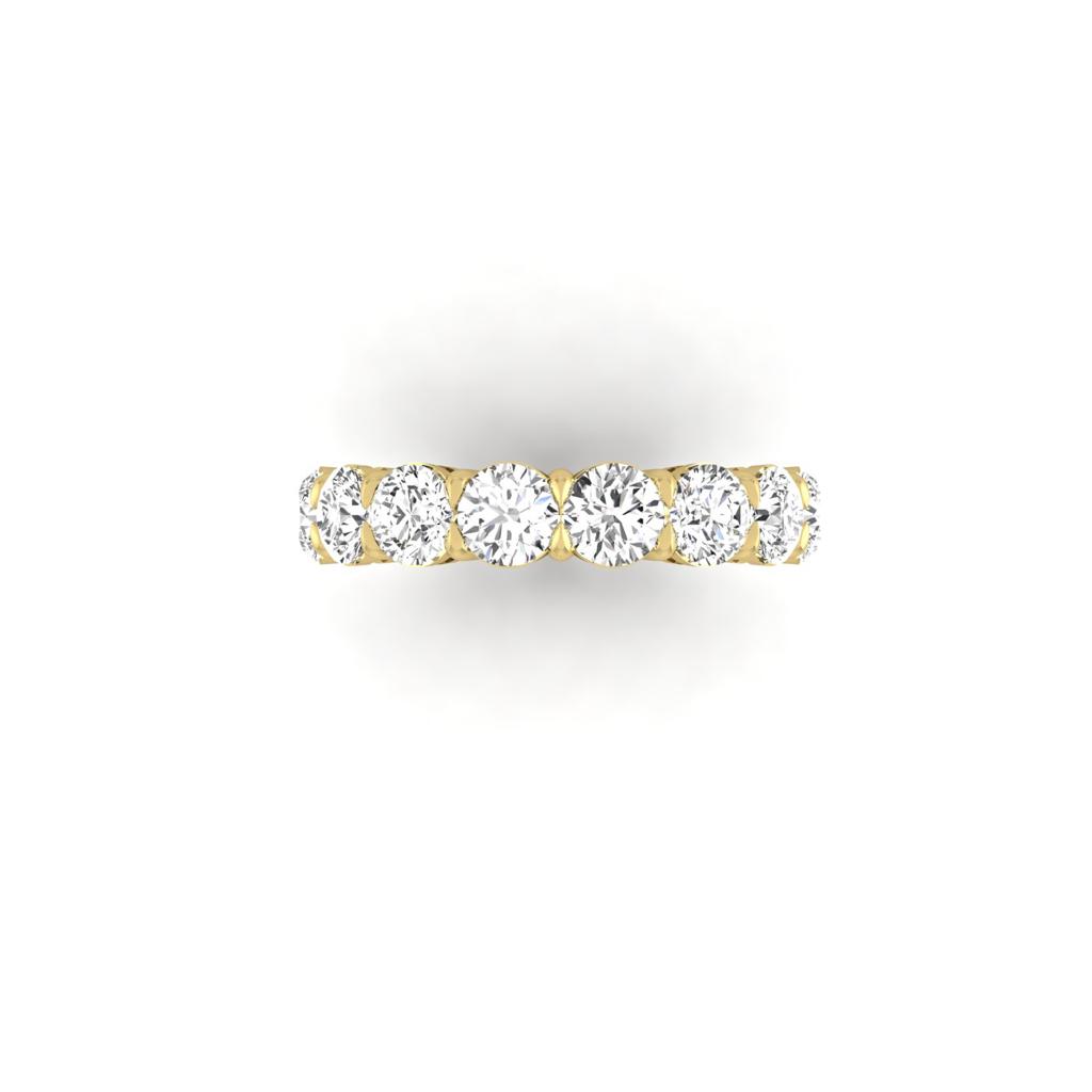 The Full Lab Grown Diamond Eternity Ring is an elegant 18KT gold band set with a row of sparkling F Color VS Clarity white diamonds, evenly spaced across the top. The round-cut diamonds are shown in the images front view against a plain white background.