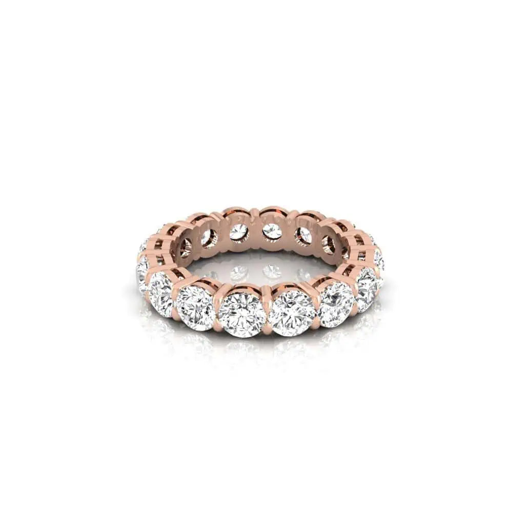 The Full Diamond Eternity Ring from Janet Heller Fine Jewelry, crafted in 18KT gold, features evenly spaced diamonds offered in various shapes and custom carat weights. The color of the diamonds is F and the clarity is VS. This is the perfect wedding band to be worn alone or stacked with your engagement ring.