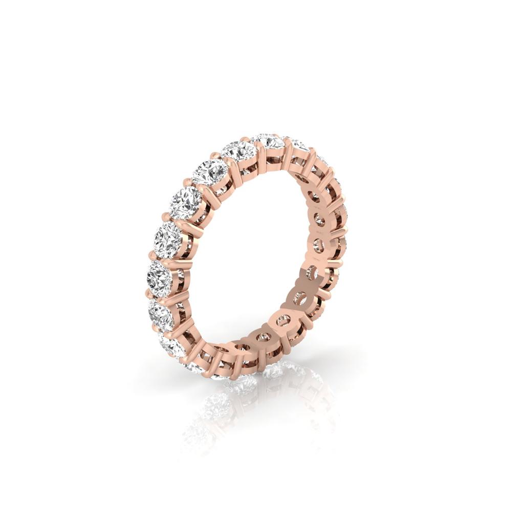 The Full Lab Grown Diamond Eternity Ring in 18KT gold features round-cut diamonds of F color and VS clarity, encircling the entire band, elegantly resting against a white background.