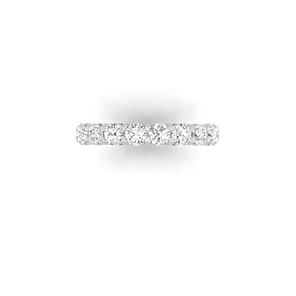 The Full Lab Grown Diamond Eternity Ring is crafted in 18KT gold featuring continuous clear, sparkling diamonds with F Color VS Clarity, elegantly displayed on a white background.