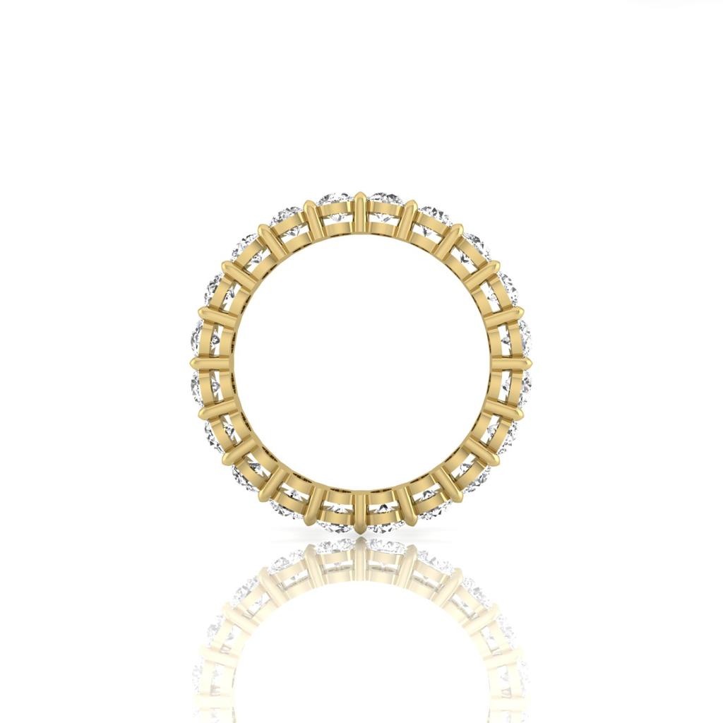 Set against a pristine white background, the Full Lab Grown Diamond Eternity Ring in 18KT gold with rectangular cutouts creates a striking scene. Its mirrored reflection enhances the symmetry, showcasing F Color VS Claritys exquisite elegance reminiscent of a dazzling diamond ring.