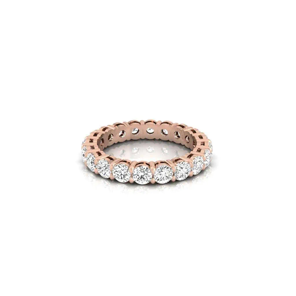 The Full Diamond Eternity Ring from Janet Heller Fine Jewelry, crafted in 18KT gold, features evenly spaced diamonds offered in various shapes and custom carat weights. The color of the diamonds is F and the clarity is VS. This is the perfect wedding band to be worn alone or stacked with your engagement ring.