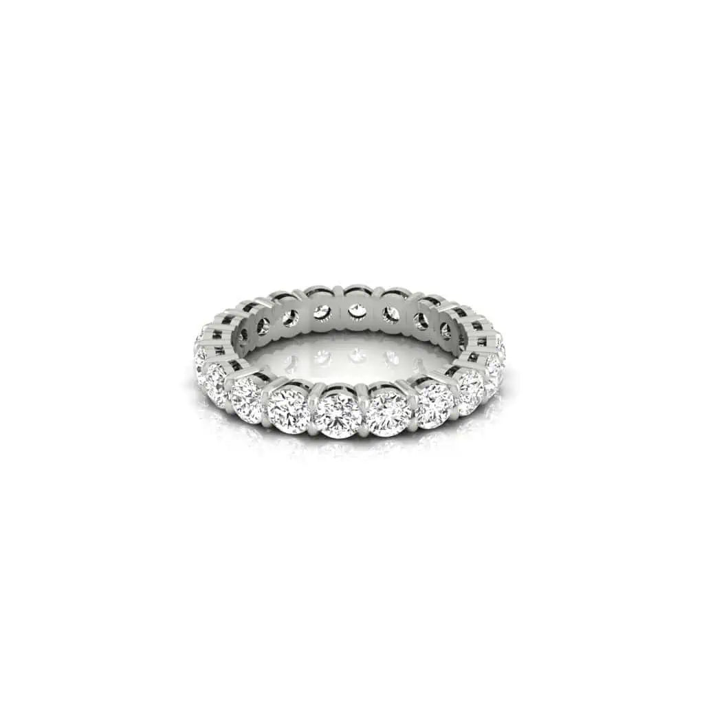 The Full Diamond Eternity Ring from Janet Heller Fine Jewelry, crafted in 18KT gold, features evenly spaced diamonds offered in various shapes and custom carat weights. The color of the diamonds is F and the clarity is VS. This is the perfect wedding band to be worn alone or stacked with your engagement ring.