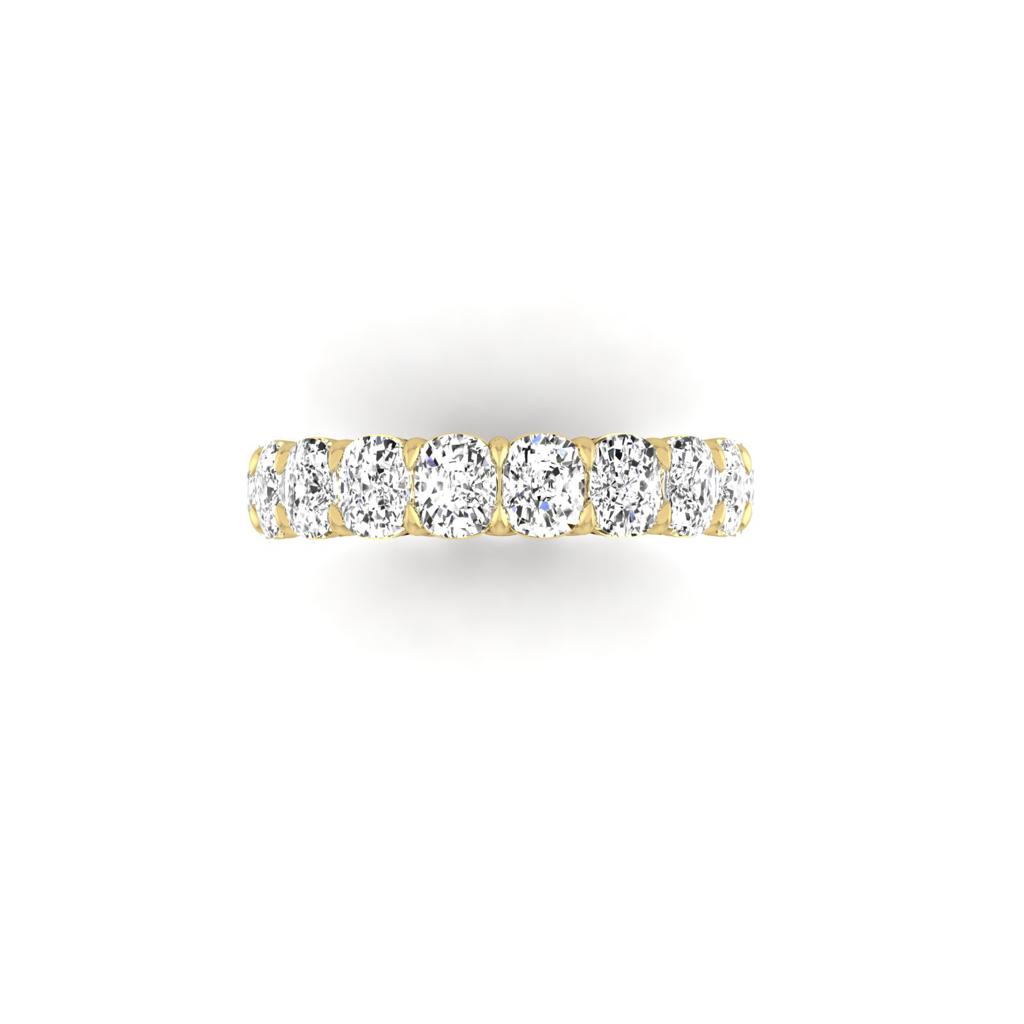 The Full Lab Grown Diamond Eternity Ring from Janet Heller Fine Jewelry, crafted in 18KT gold, features evenly spaced diamonds offered in various shapes and custom carat weights. The color of the diamonds is F and the clarity is VS. This is the perfect wedding band to be worn alone or stacked with your engagement ring.
