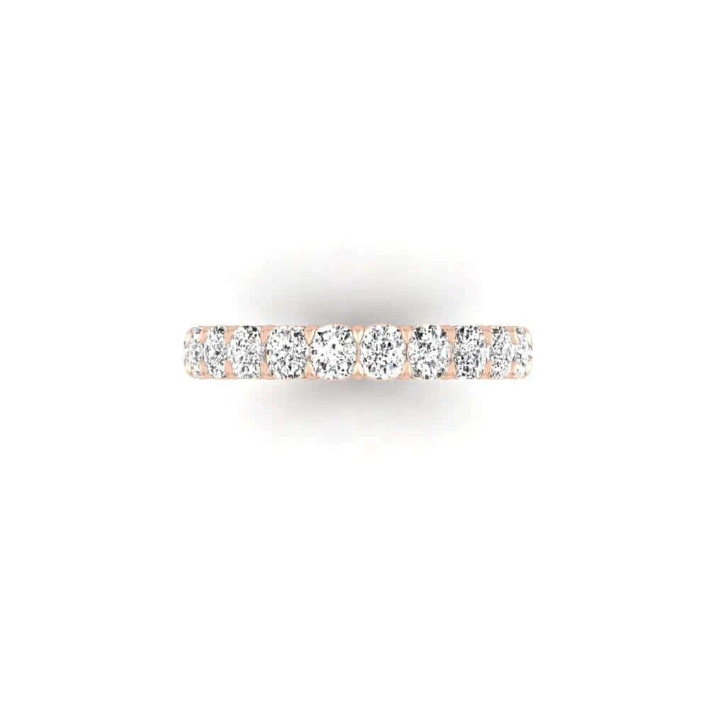 The Full Diamond Eternity Ring, crafted in 18KT rose gold with customizable round-cut diamond carat weights, is elegantly showcased against a pristine white backdrop.