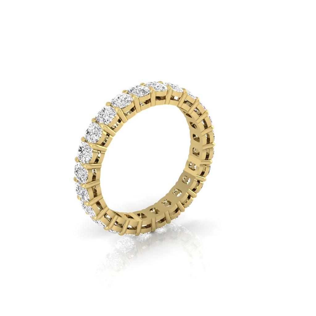 The Full Lab Grown Diamond Eternity Ring from Janet Heller Fine Jewelry, crafted in 18KT gold, features evenly spaced diamonds offered in various shapes and custom carat weights. The color of the diamonds is F and the clarity is VS. This is the perfect wedding band to be worn alone or stacked with your engagement ring.