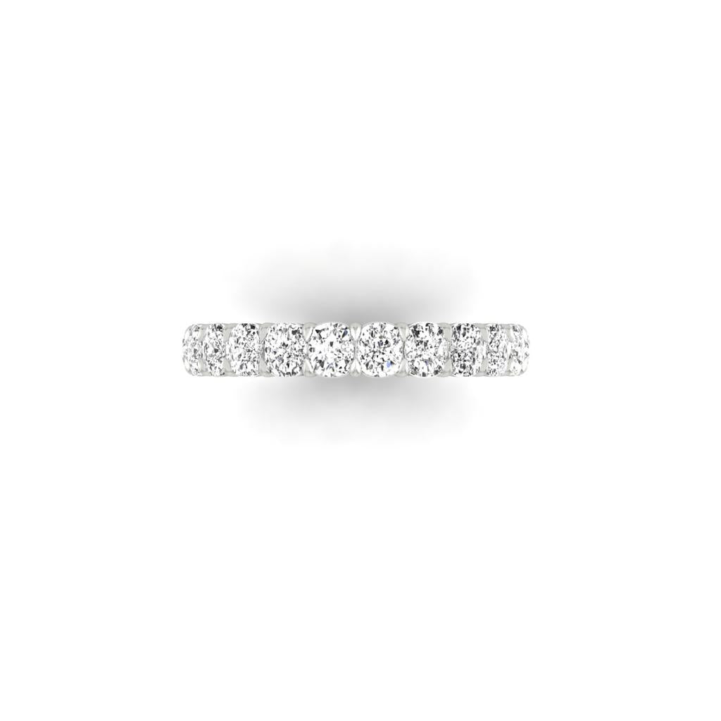 The Full Lab Grown Diamond Eternity Ring is crafted in 18KT gold, featuring a row of sparkling diamonds with F color and VS clarity, elegantly set along the band against a plain white background.